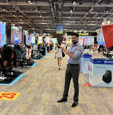 a man standing in a room with a video game controller  zoom in a bit 