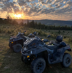 a couple of atvs parked in a field