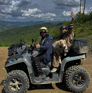 a man and a woman riding on a quad