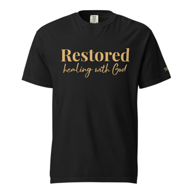 Black graphic t-shirt featuring Restored Healing with God in gold elegant typography.