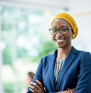 a woman in a blue jacket and yellow hat