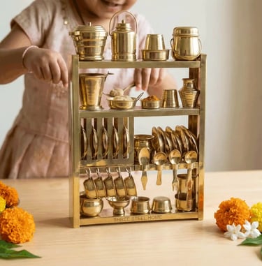 Girl playing with miniature brass kitchen set