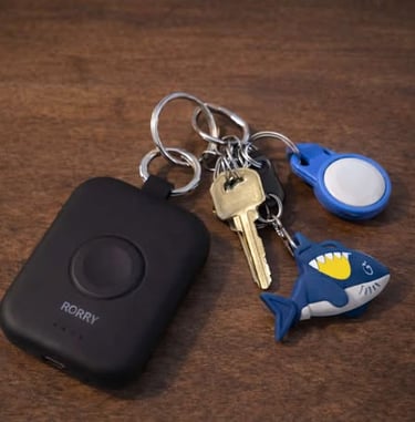 Portable power bank attached to a keychain for charging devices while on the go
