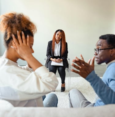 Therapist helping a couple communicate during an emotionally charged therapy session Couples therapy