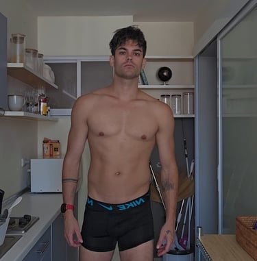 a man wearing black boxer shorts taken in a kitchen