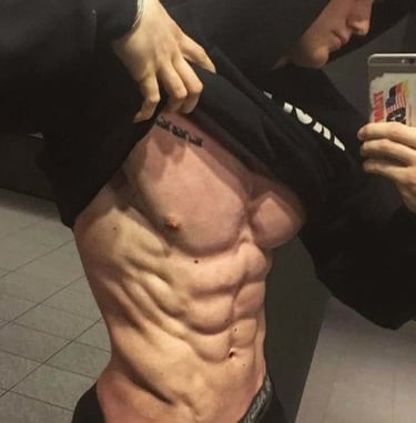 a man revealing his muscular abdomen