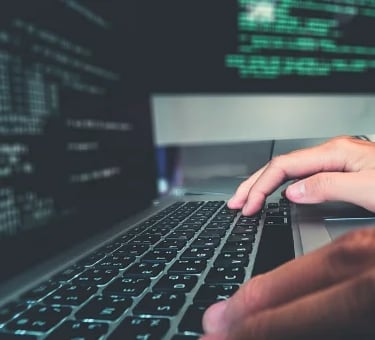 Developer writing codes to create better software solutions
