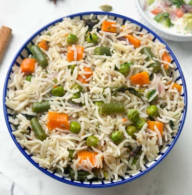 Vegetable Pulao, a fragrant, one-pot rice dish cooked with a medley of fresh vegetables & spices.