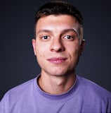 a man with a purple shirt