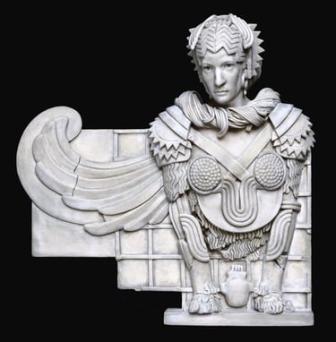 Small ceramic wall sculpture of a winged female Sphinx.