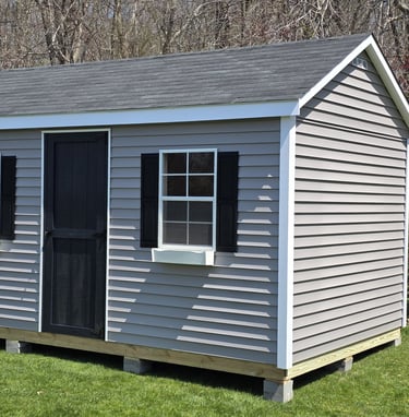 10x16 vinyl storage shed custom built in Pembroke, Massachusetts, low-maintenance outdoor storage.