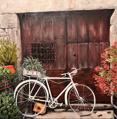 A typical front door of a house in Mogarraz. An old bike and flowers