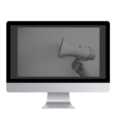 a person holding a megaphone in front of a monitor