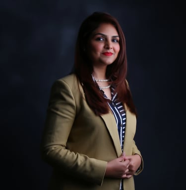 Zaira @ Exxaura in a yellow blazer and a black and white shirt