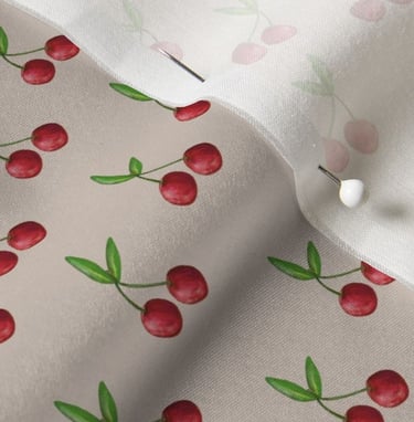 a close up of a fabric covered fabric with cherries and cherries