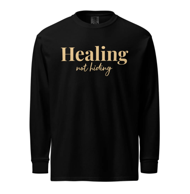 Black long-sleeve shirt featuring gold text that reads Healing not hiding for mental health awareness.