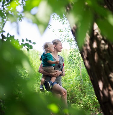 Kara holding child in nature which is beneficial for your health