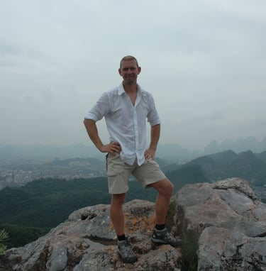 Nick and Tracey Billington climbing the hills above the city of Guilin, China
