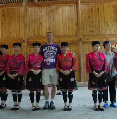 Nick Billington with traditional long haired women at Huangluo Yao Village, China