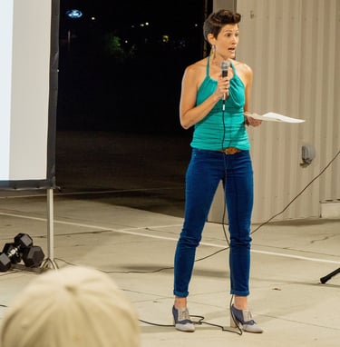 Woman standing with microphone