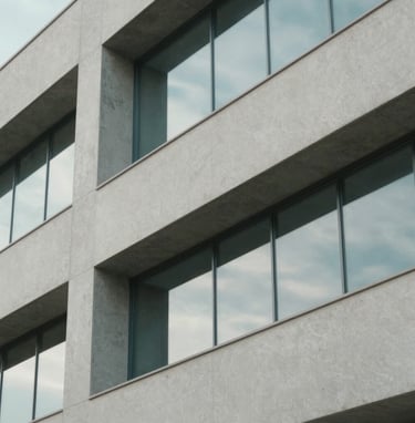 Close-up of modern Brazilian architectural details, clean lines of concrete and glass, soft natural light with reflections of baby blue sky. Minimalist and professional composition with light gray tones.