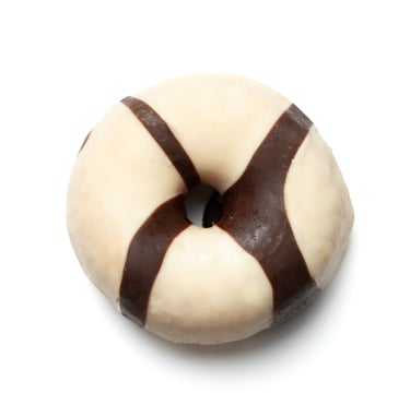 a chocolate covered donut with chocolate icing
