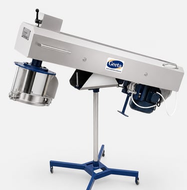 Industrial stainless steel food processing extruder machine on a wheeled stand for manufacturing.
