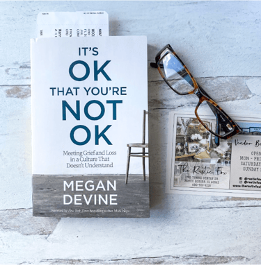 Grief Book on Desk with Reading Glasses