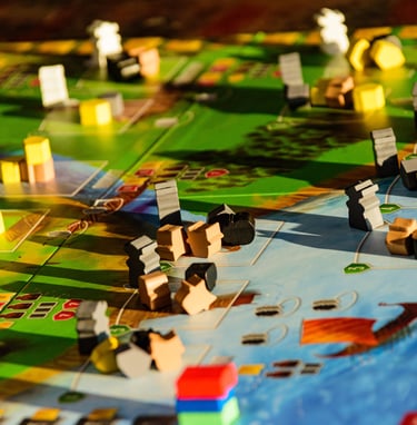 a board game with a small models meeples