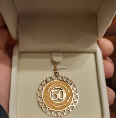 a person holding a medal in a box