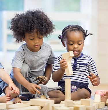kids building with blocks