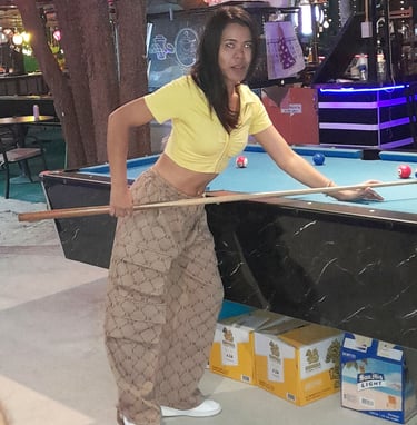 Thai woman playing pool at bar at Wonderland 2 in Hua Hin