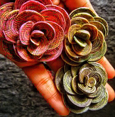 Recycled paper marble rose on the hand 