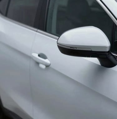 The 'After' image of the same car door from zHDKit, now perfectly smooth and flawless. The reflection of the light is straight and uninterrupted, showing professional PDR results.