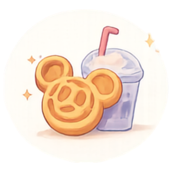 A golden Mickey Mouse shaped waffle next to a blue iced milkshake with a pink straw.