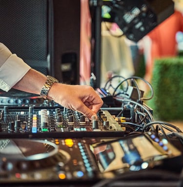 DJ Mixing on decks at drinks reception