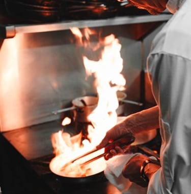 An image of a chef cooking to indicate the higher turnaround and increased food and beverage sales