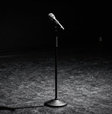 An elegant, minimalist image of a classic microphone stand on a dark, empty stage, dramatic top lighting creating long shadows, deep anthracite and charcoal tones.