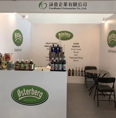 Osterberg food service booth featuring fruit syrups, crushes, and jam raw materials at a trade show.