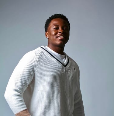 a man in a white sweater and white pants