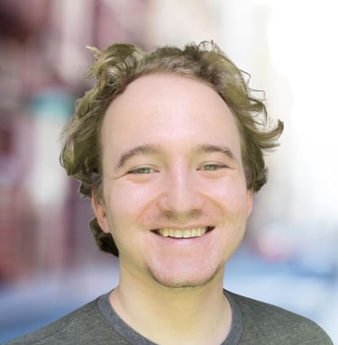 a man with a beard and a beard smiling