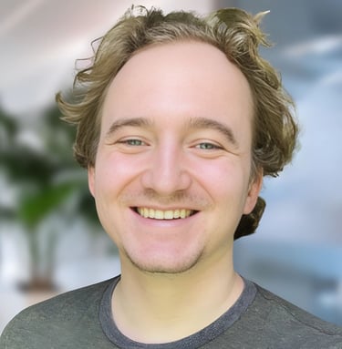 a man with a beard and a beard smiling