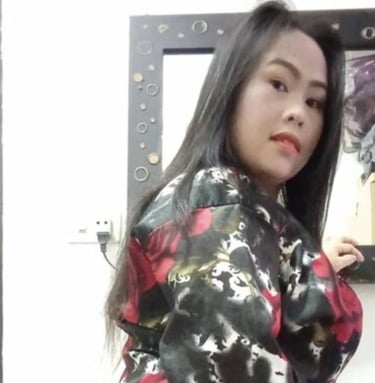 Side angle view of lady wearing long sleeve patterned dress