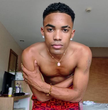 Man wearing red boxer shorts bending forward with his arms crossed