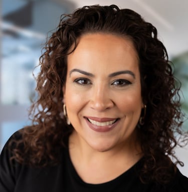 a woman with curly hair and a black shirt