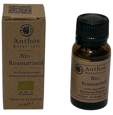 a bottle of rosemary essential oil with a box of rosmaan oil