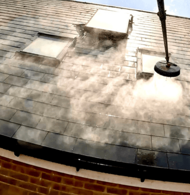 roof cleaning using a telescopic pole and a surface cleaner attached to a pressure washer