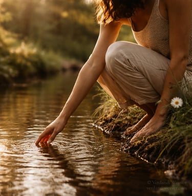 Person gently connecting with nature in warm, grounded presence