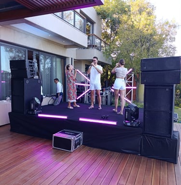DJ and live performance stage with professional sound and lighting system for a private event in Bod