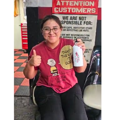 Satisfied customer showing appreciation for Fast Tire Shop’s friendly and professional service in Ea